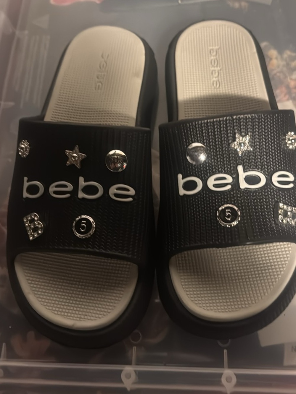 bebe Black and Cream Slide Sandals with Silver Stud Accents